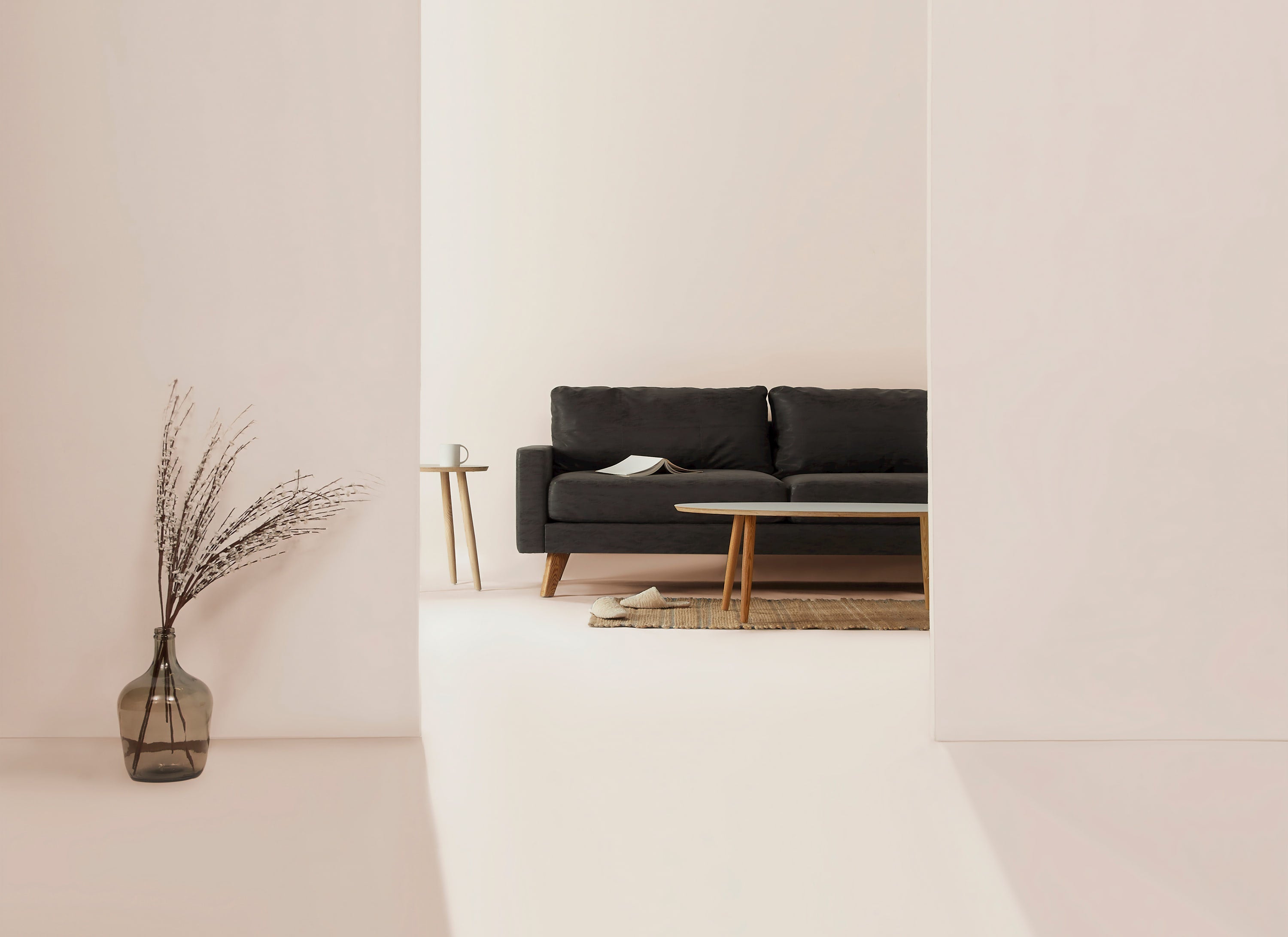 Minimalist living room with neutral tones and simple, clutter-free decor.