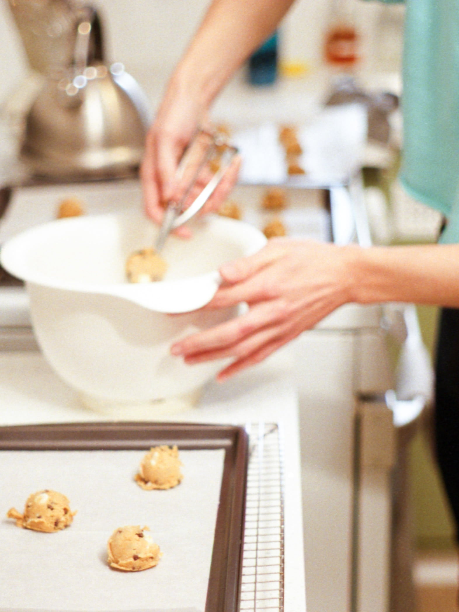 Actor Dino Petrera, scooping chocolate chip cookies in his kitchen