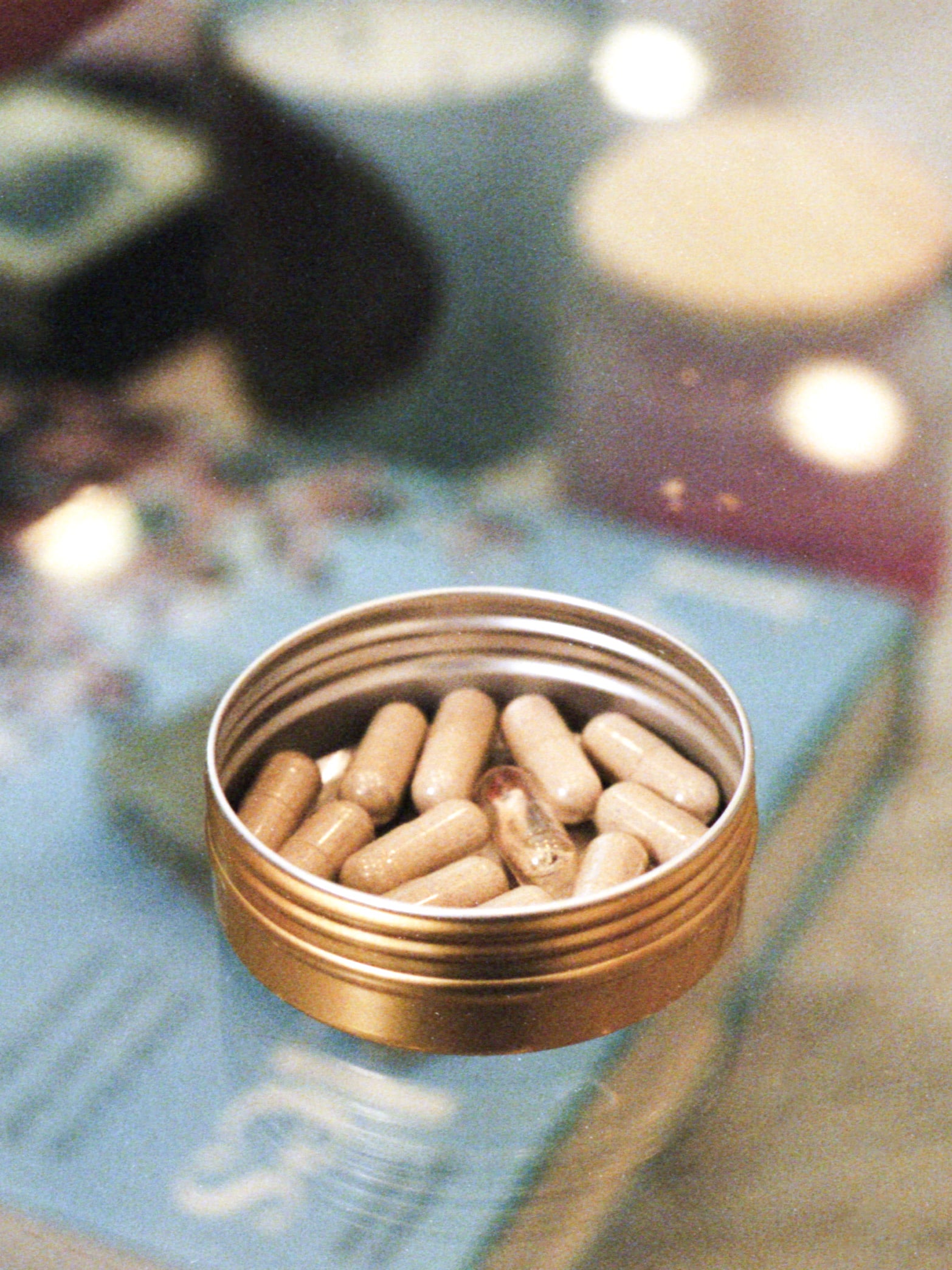 Katie Maloney's tin of pills, including one that is psilocybin, which has a mushroom inside of it