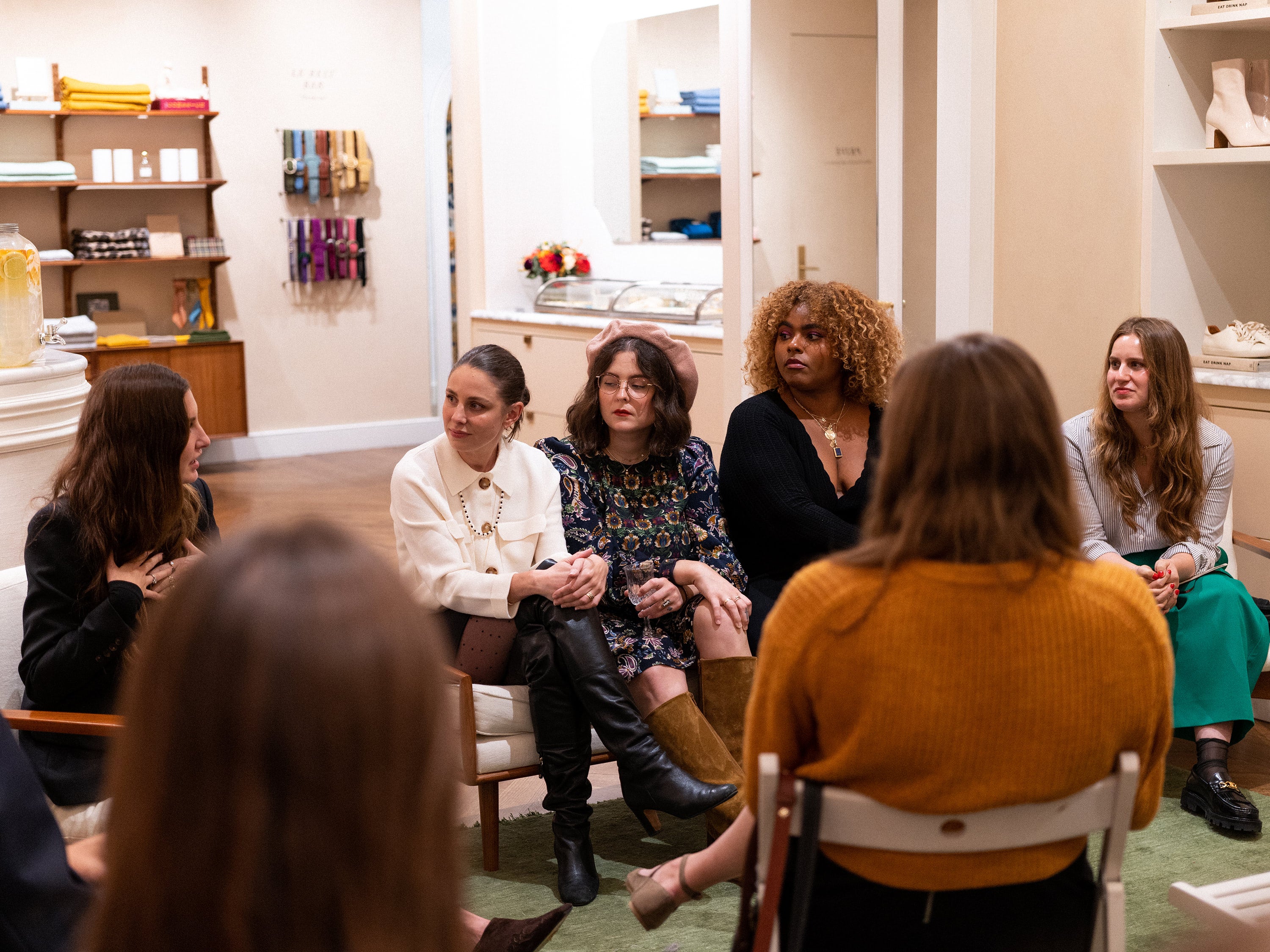 And Repeat Open Book Club community event with Jayme hosting a live panel discussion with guests, fostering conversations on mental wellness and entrepreneurship.