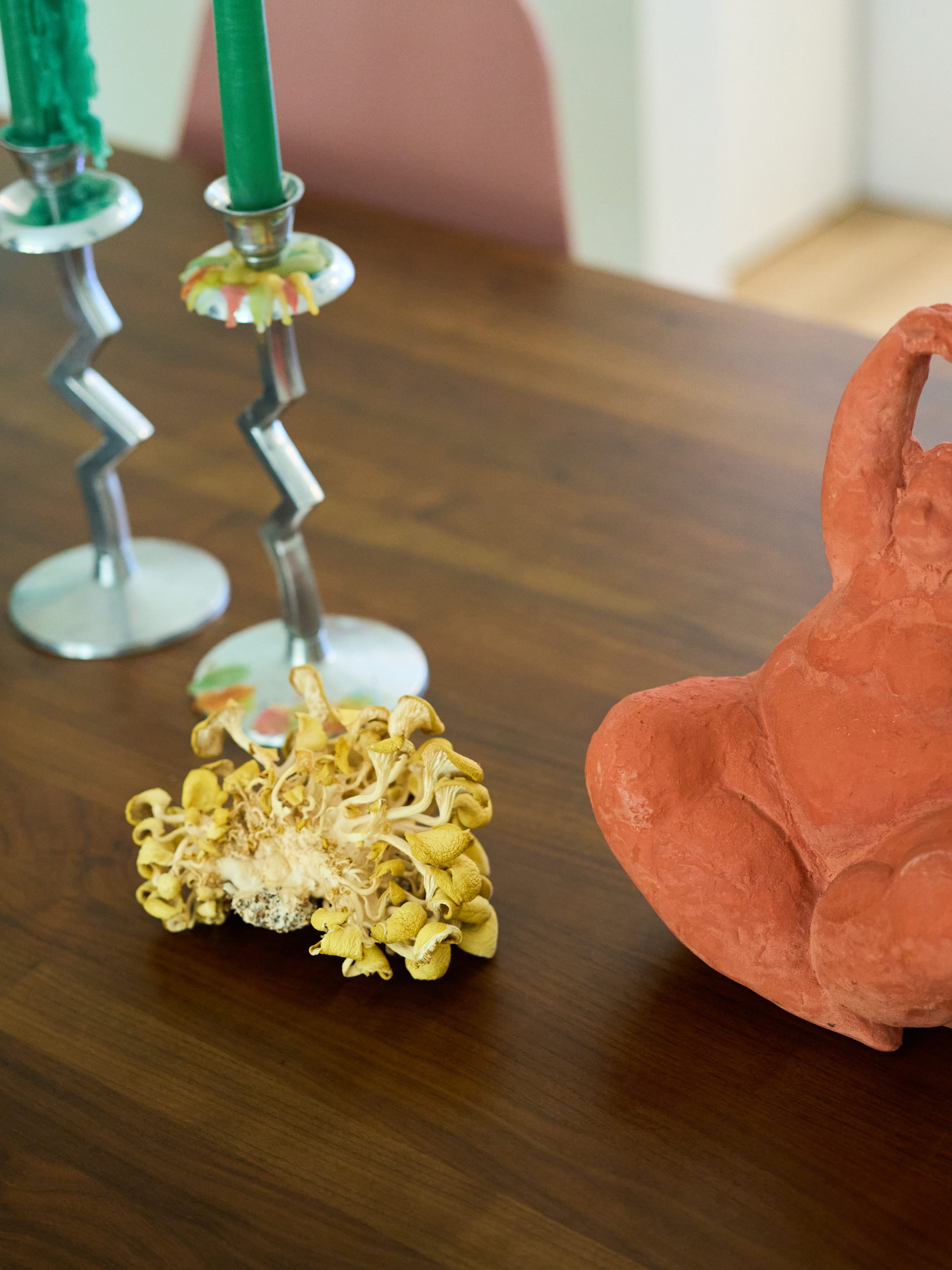 Chef Sandy Truong An Tran Ho's kitchen table with candles and an oyster mushroom