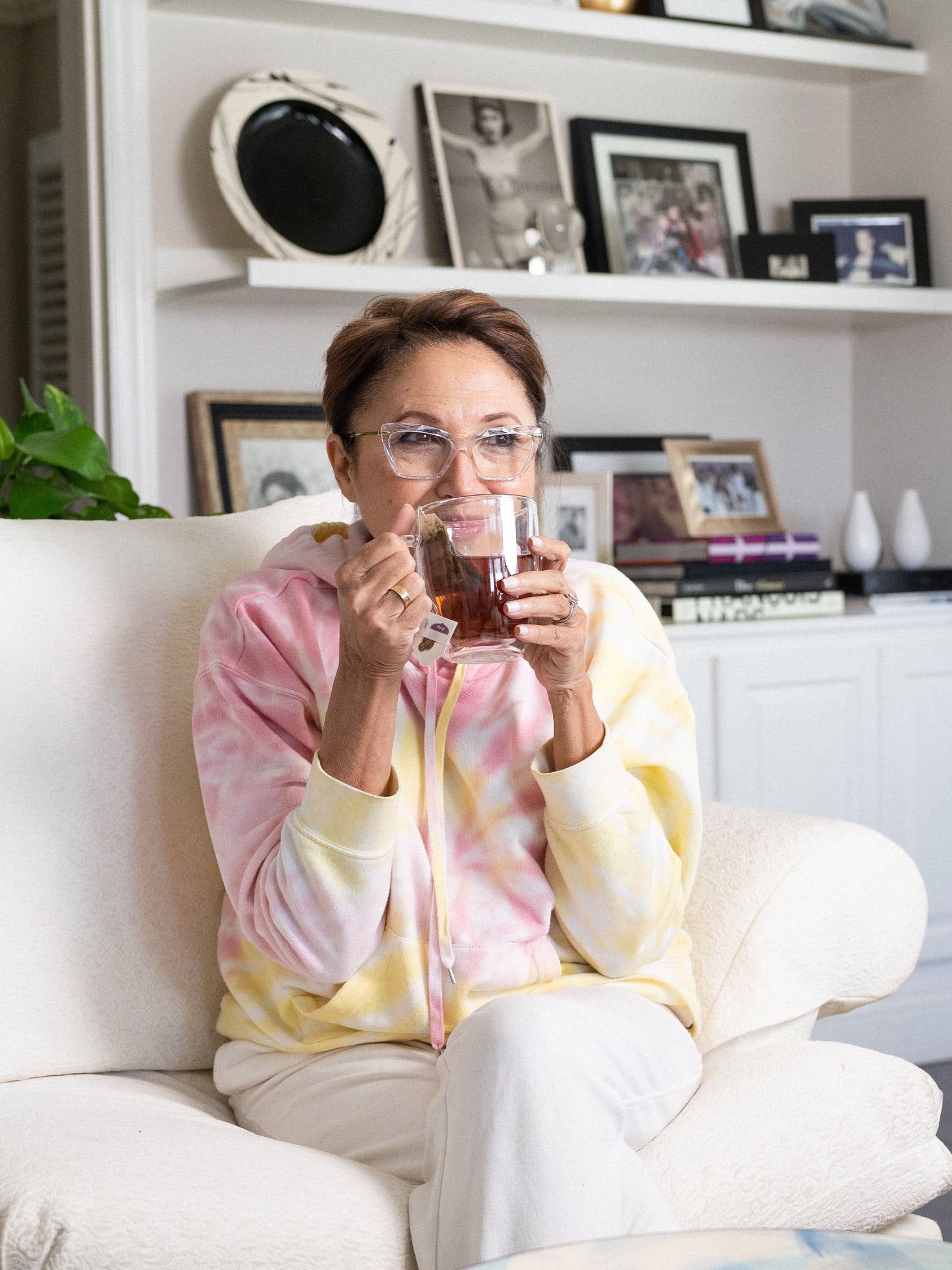 Margarita Arriagada, founder of Valde Beauty, enjoying a cup of tea while sitting in her living room.