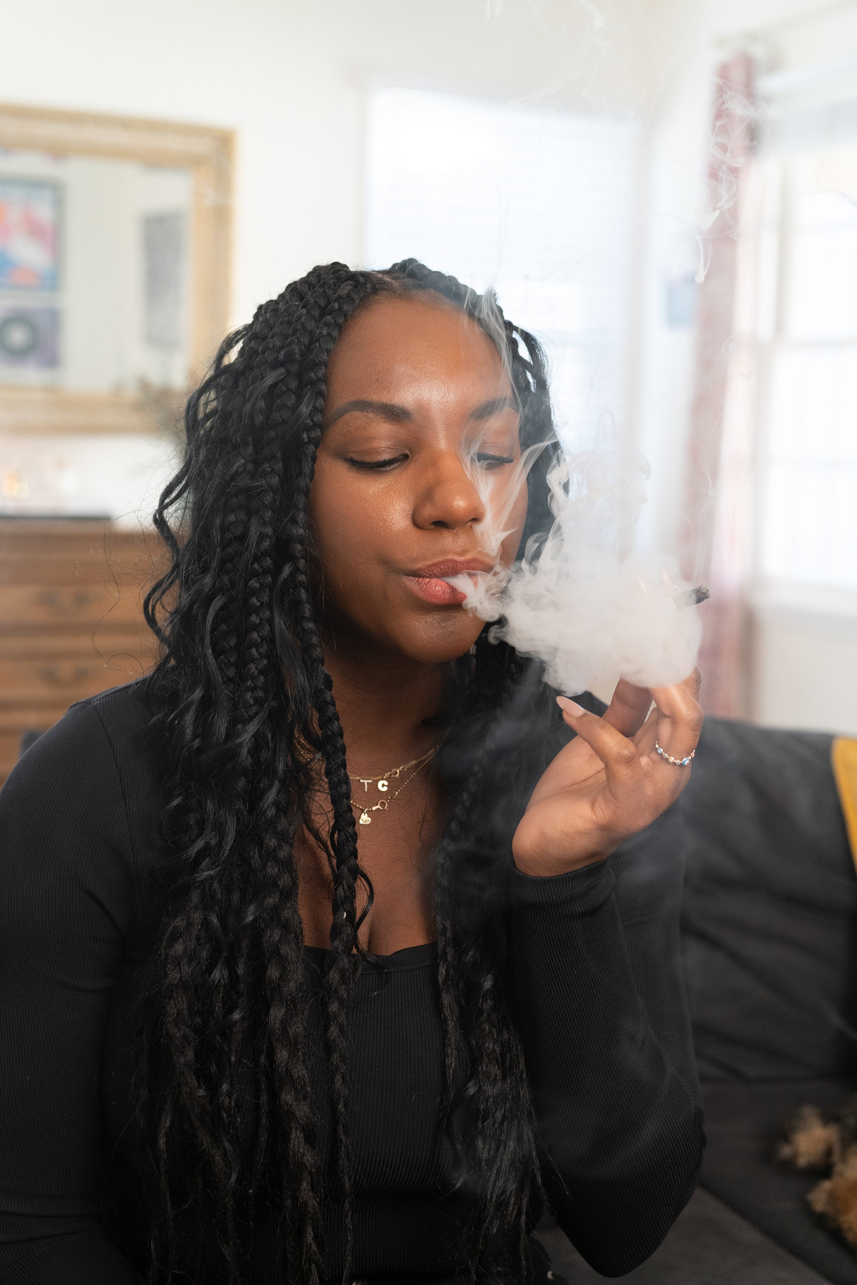 The founder of Saucy, Tess Taylor, smoking a joint